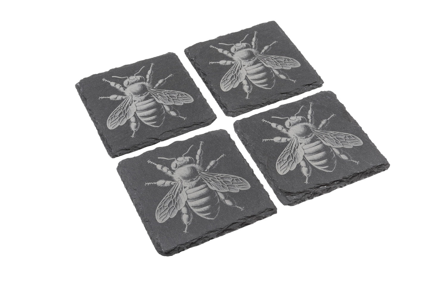 Set of four natural slate coasters with etched bee design