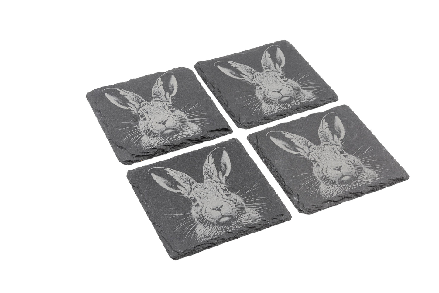 Set of four natural slate coasters with etched hare design