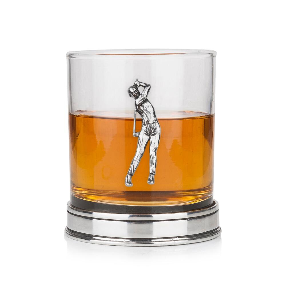 Whisky tumbler with pewter golfer emblem and polished base, partially filled with amber liquid
