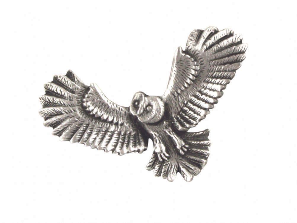 Silver owl brooch with detailed feathers and outstretched wings.