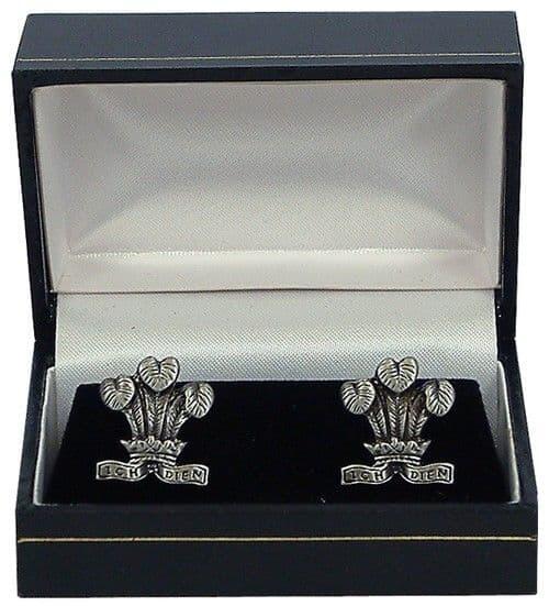 Silver cufflinks with leaf design in a black gift box.