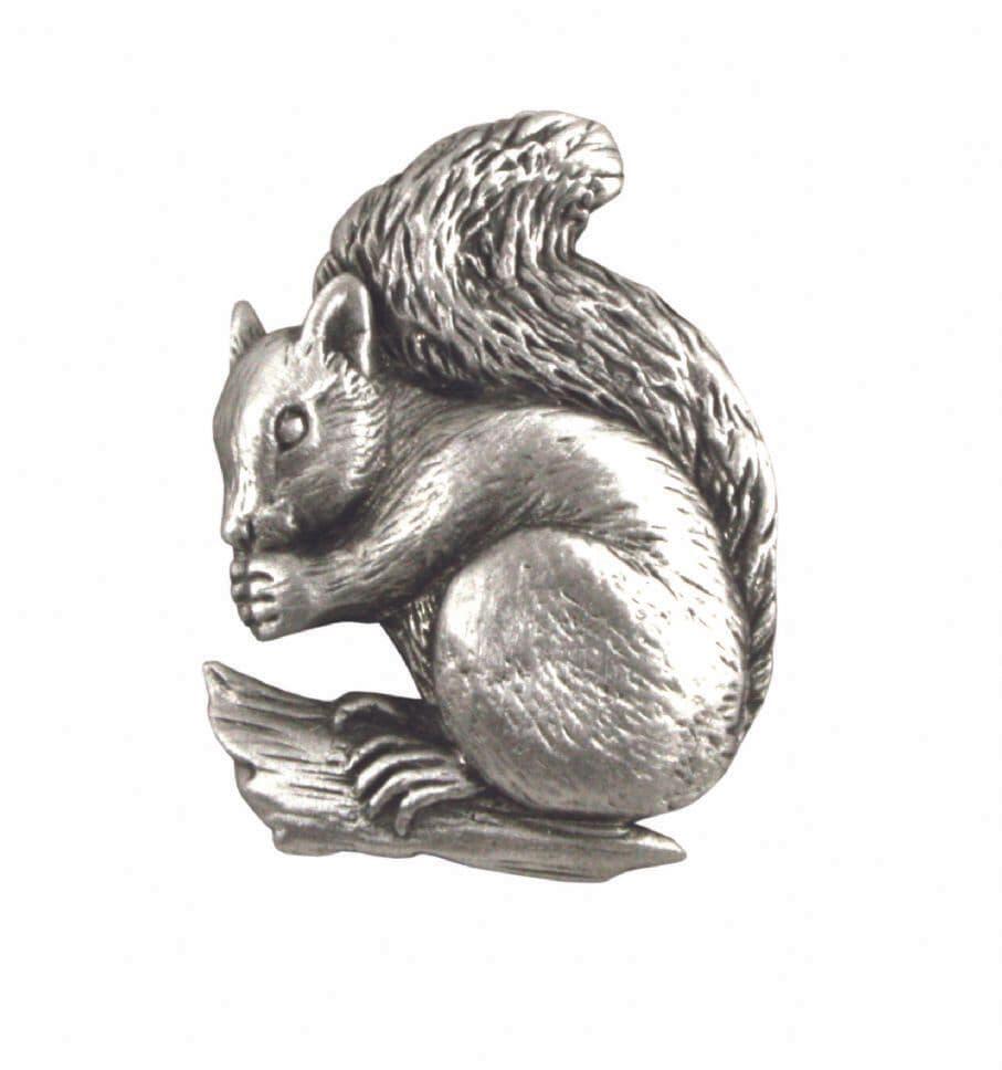 Silver squirrel figurine perched on a wooden branch, detailed fur texture and realistic pose.