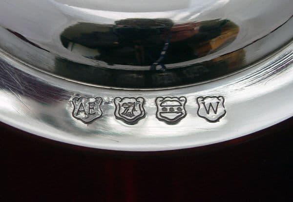 Silver-plated serving tray with intricate engravings and hallmark stamps.