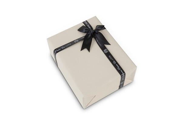 Cream-colored gift box with black 'A E Williams' ribbon and bow