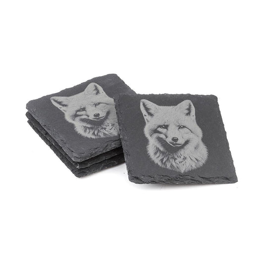 Natural slate coasters with etched fox design displayed in stacked arrangement