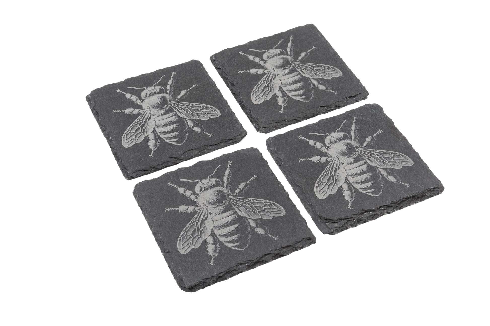 Set of four natural slate coasters with etched bee design