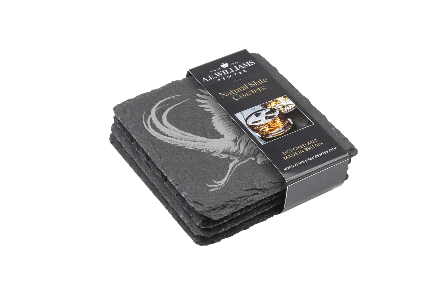 The top coaster features an engraved Pheasant design. A product label wraps around the stack, displaying the brand name, product type 'Natural Slate Coasters', and an image of a whiskey glass on a coaster. The label states 'Designed and Made in Britain' and includes the company website.