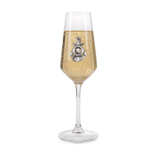 Crystal champagne flute with pewter anchor emblem, filled with bubbly champagne