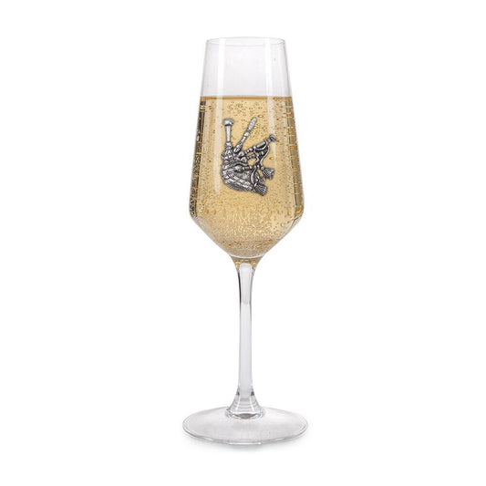 Crystal champagne flute with pewter bagpipes emblem, filled with bubbly champagne