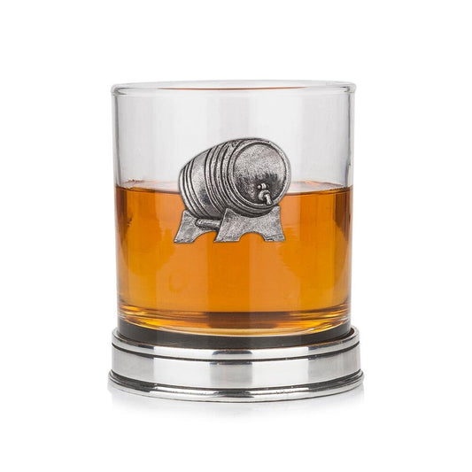 Whisky tumbler with pewter whisky barrel emblem and polished base, partially filled with amber liquid