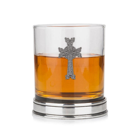 Whisky tumbler with pewter crab emblem and polished base, partially filled with amber liquid