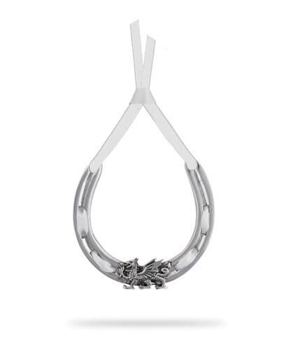 Handcrafted pewter dragon horseshoe with ribbon, a unique wedding gift by A E Williams.