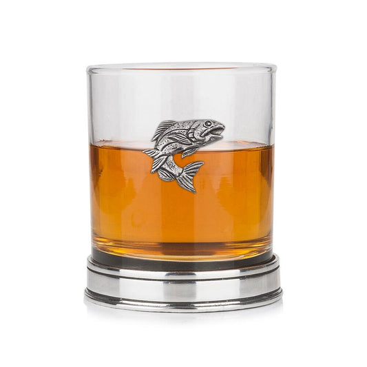 Whisky tumbler with pewter salmon fish emblem and polished base, partially filled with amber liquid