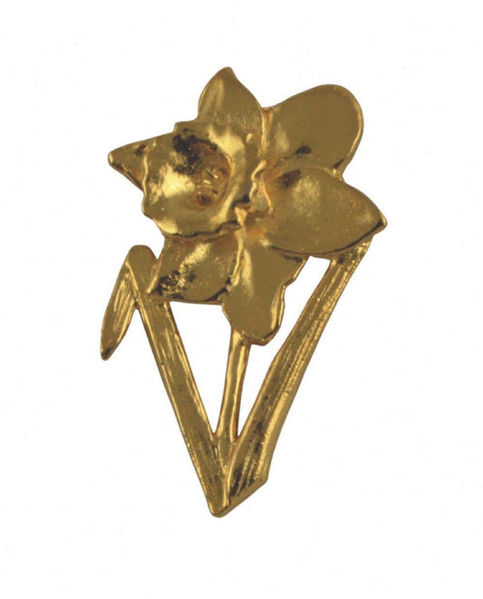 Gold flower brooch with daffodil design and a V-shaped stem.