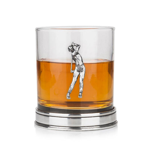 Whisky tumbler with pewter golfer emblem and polished base, partially filled with amber liquid