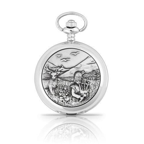 Silver pocket watch featuring an engraved scene of a child playing bagpipes with a deer in a landscape.