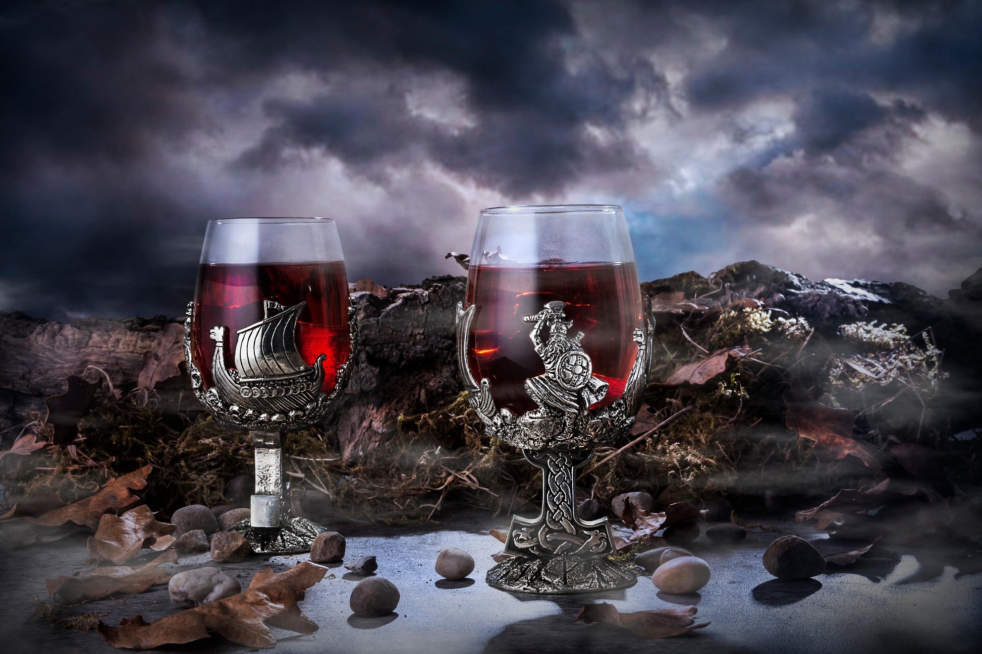 Ornate Viking-themed glasses with red wine, set against a dark, moody background