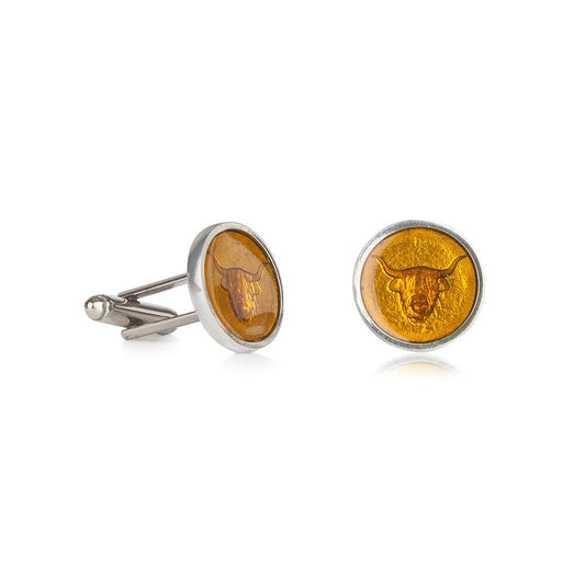 Handcrafted pewter cufflinks with a detailed Highland cow embossed in transparent yellow enamel