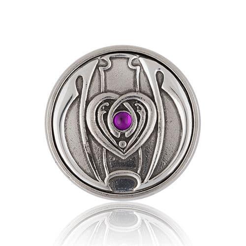 Silver-tone heart-shaped pendant with a purple gemstone center.