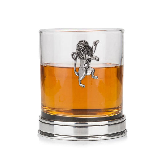 Whisky tumbler with pewter Rampant Lion emblem and polished base, partially filled with amber liquid