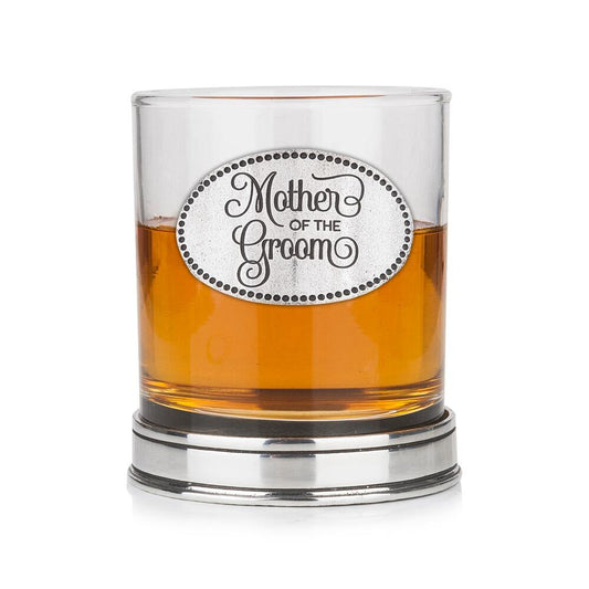 Whisky tumbler with pewter 'Mother of the Groom' badge and polished base, partially filled with amber liquid