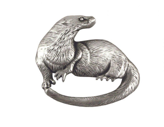 Silver-toned metal brooch in the shape of a stylized otter.