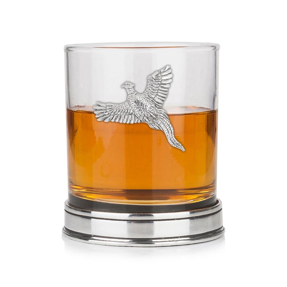 Whisky tumbler with pewter pheasant motif and polished base, partially filled with amber liquid