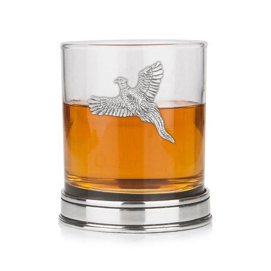 Whisky tumbler with pewter pheasant motif and polished base, partially filled with amber liquid
