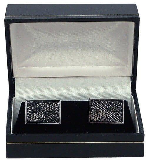 Silver ornate cufflinks displayed in a black gift box with a velvet interior.