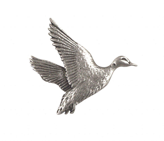 Silver flying duck brooch with detailed feather texture.