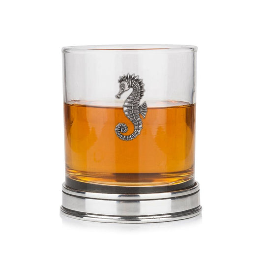 Whisky tumbler with pewter seahorse motif and polished base, partially filled with amber liquid