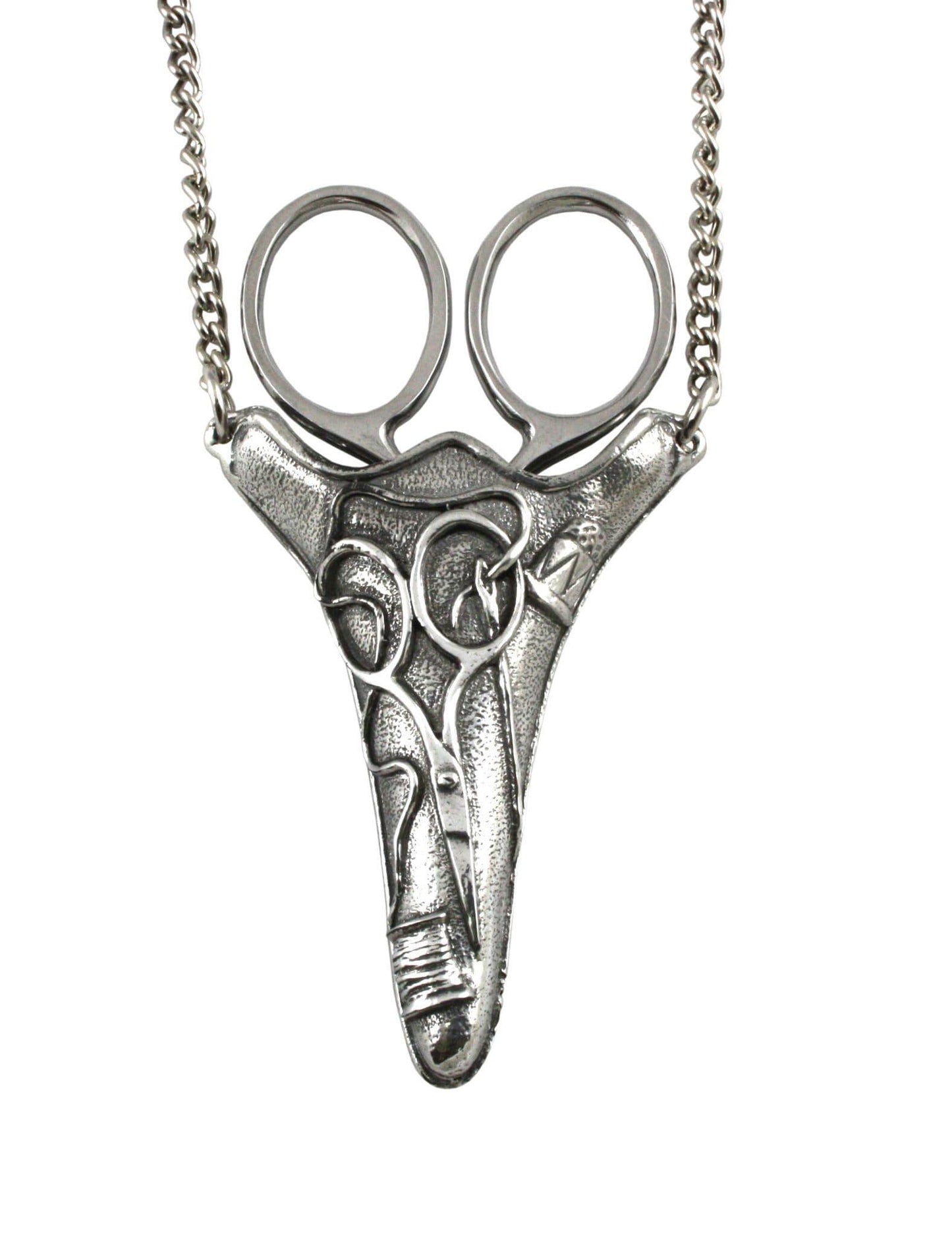 Silver pendant necklace featuring a unique scissor design with a chain.