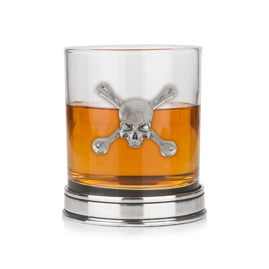 Whisky tumbler with pewter skull motif and polished base, partially filled with amber liquid
