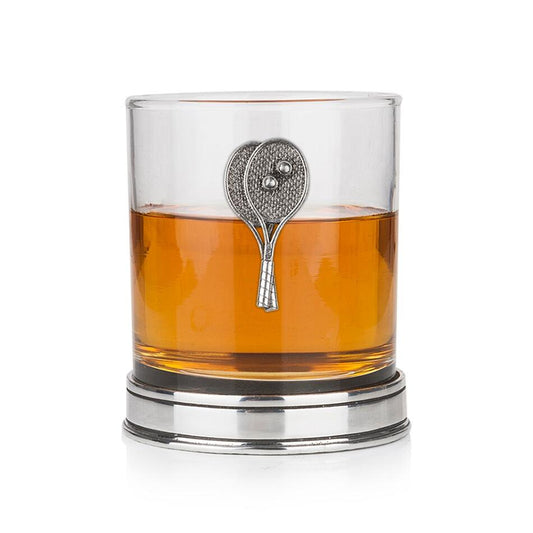 Whisky tumbler with pewter tennis motif and polished base, partially filled with amber liquid