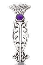 Silver thistle brooch with purple gemstone detail