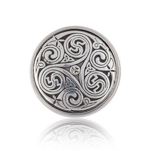 Silver circular pendant featuring intricate swirling Celtic knot design.