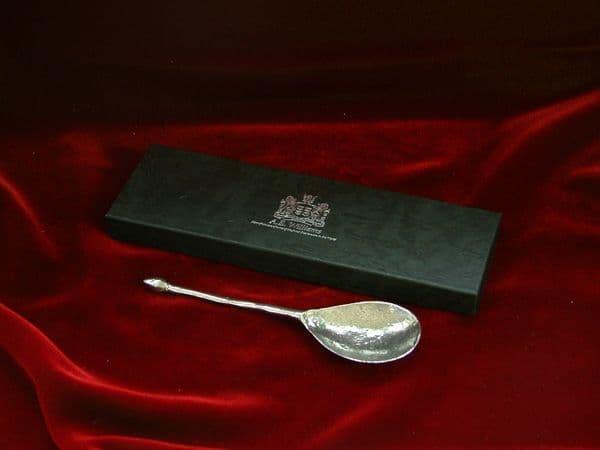 Black wooden spoon with a smooth finish, branded by My Store, ideal for cooking and serving.