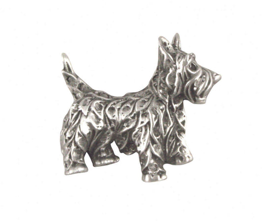 Silver Scottish Terrier figurine with intricate leaf detailing.